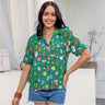 Bring on the holidays! Get festive in our Holidaze Women's Christmas shirt, made of soft rayon material. Featuring colourful and retro Christmas elements like Santa, gingerbread and candy canes on a green base, it's sure to give your wardrobe the jolly treatment it deserves!