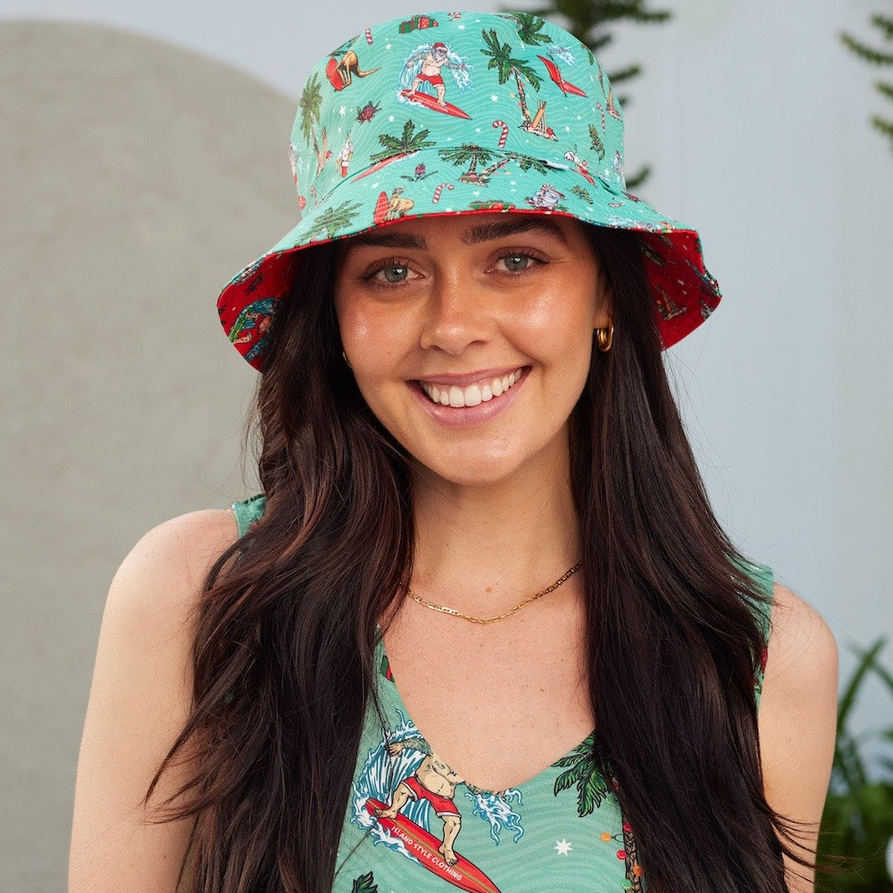 We heard on the bush telegraph that Island Style Clothing has new Christmas designs! Dive into the festive spirit with this Aussie Christmas Red Bucket Hat!  Red one side and green the other. You'll be spreading cheer and keeping the sun out of your eyes with its reversible design. So, get your hat on and get ready for a ho-ho-holiday season!  View other matching items in the Aussie Christmas Collection.