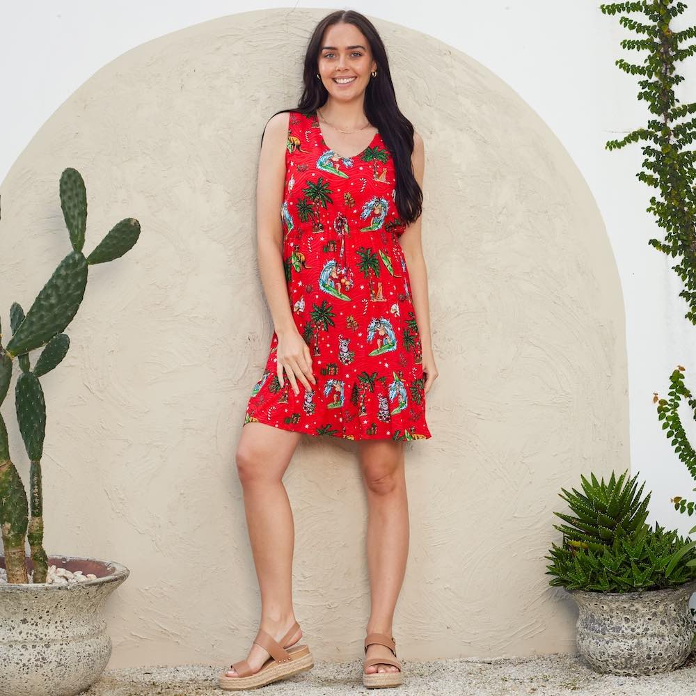 Look festively fabulous in this Aussie Christmas Red dress! Perfect for all of your holiday events, this dress features a classic silhouette that flatters all figures. So show up to those holiday parties feeling jolly and looking oh-so-chic! Matching Mens and Kids Hawaiian Shirts are available as well as pet bandanas.   This dress features a soft v-neck, adjustable (non-elastic) waist tie, and ruffled hem. 100% Rayon.